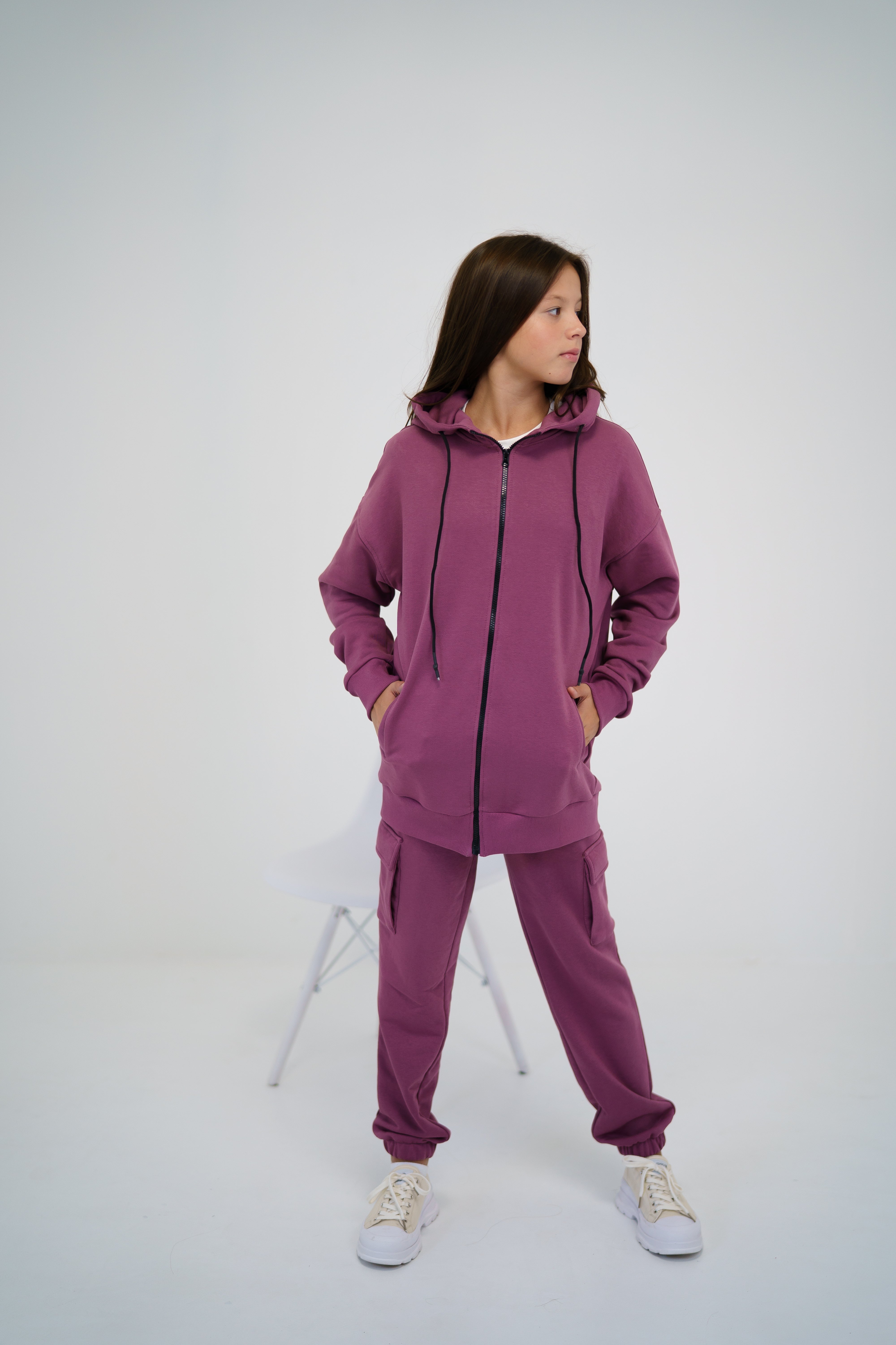 girl wearing a pink tracksuit by Lemoni - zip-hoodie 